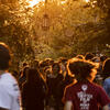 Group of students walking down polett walk at sunset